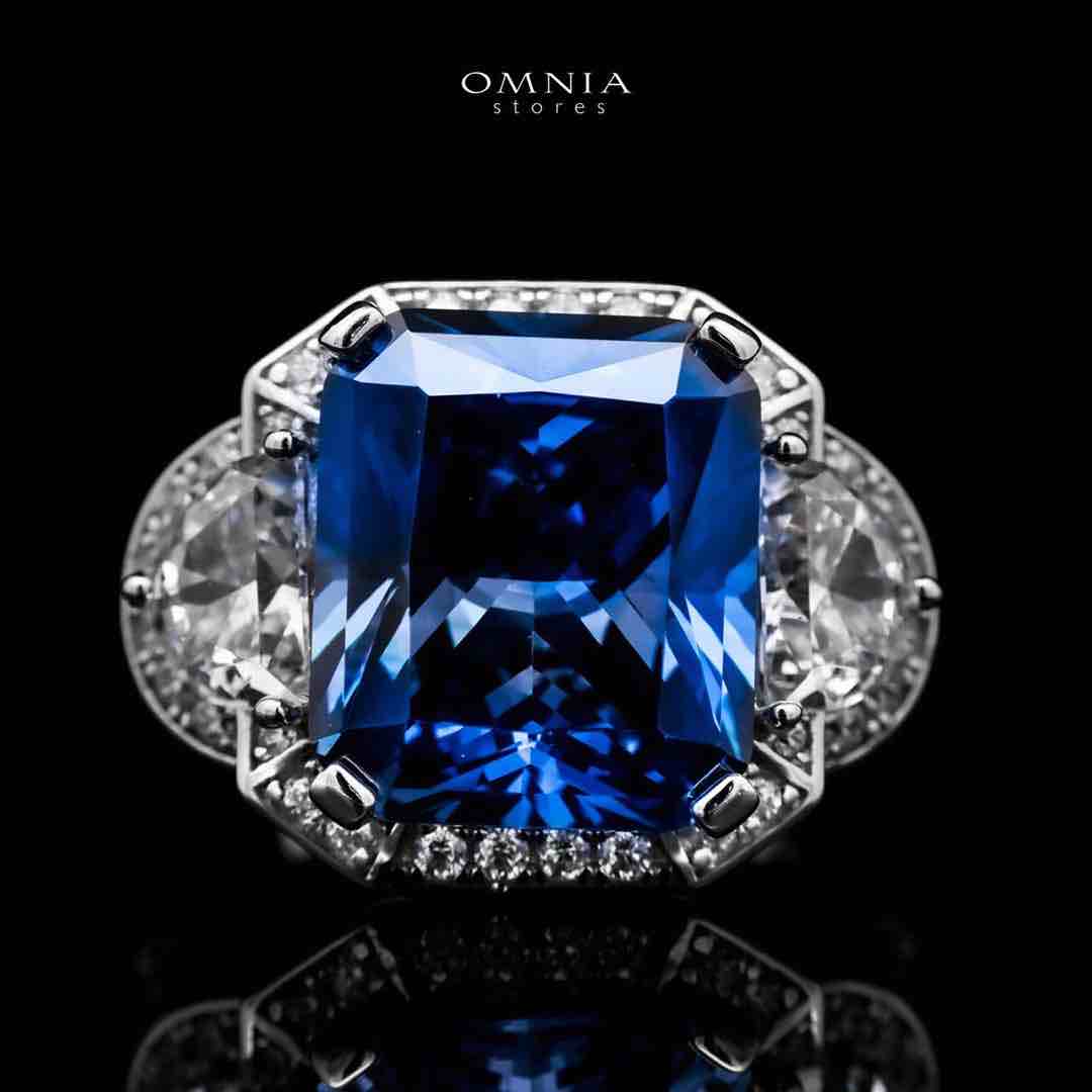 Omnia Sadeen Emerald Cut Sapphire Blue Ring in 92.5 Silver with High Quality Simulated Diamonds image number null