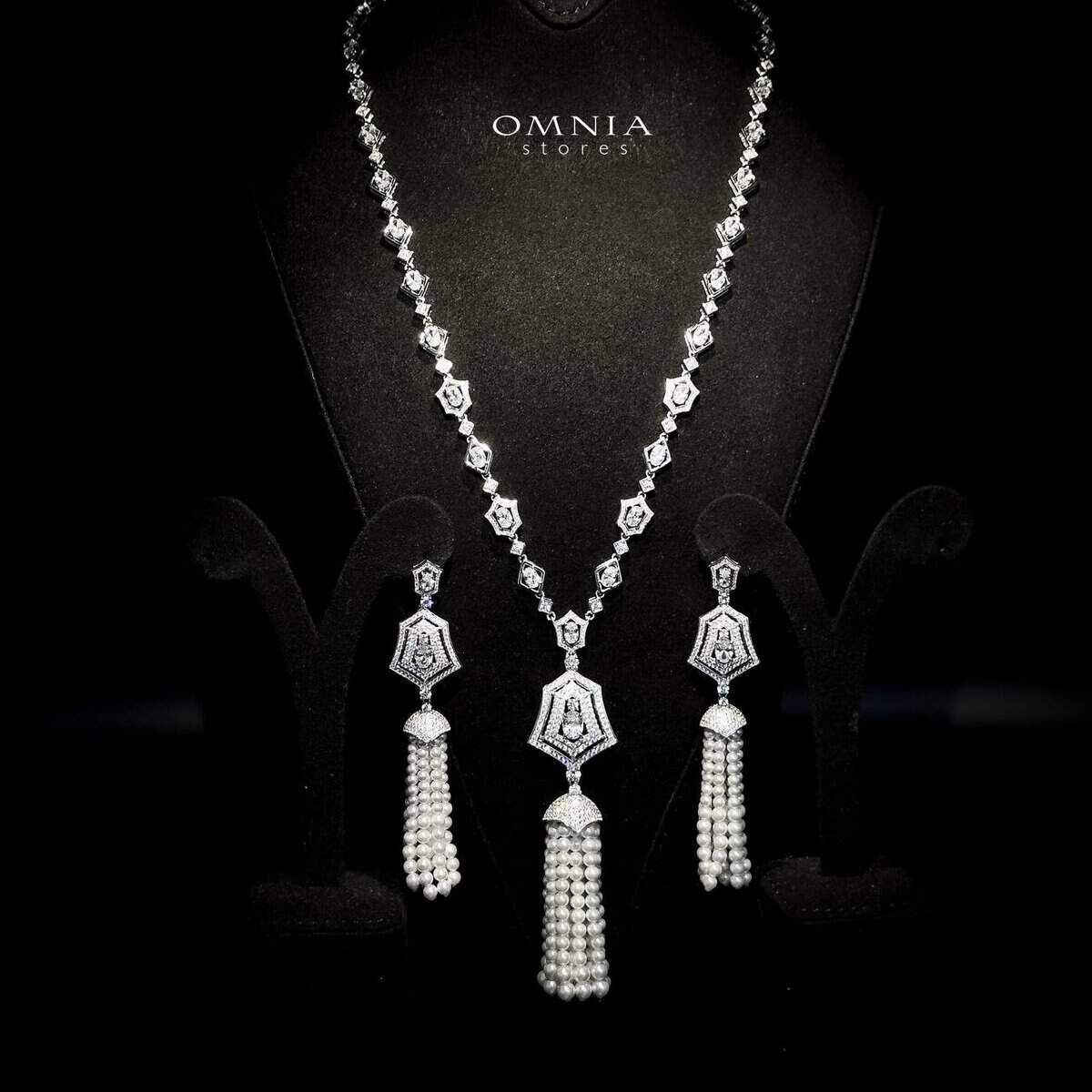 Omnia Lulu White Set in 92.5 Silver with High Quality Simulated Diamonds and Pearl Tassel Detailing image number null