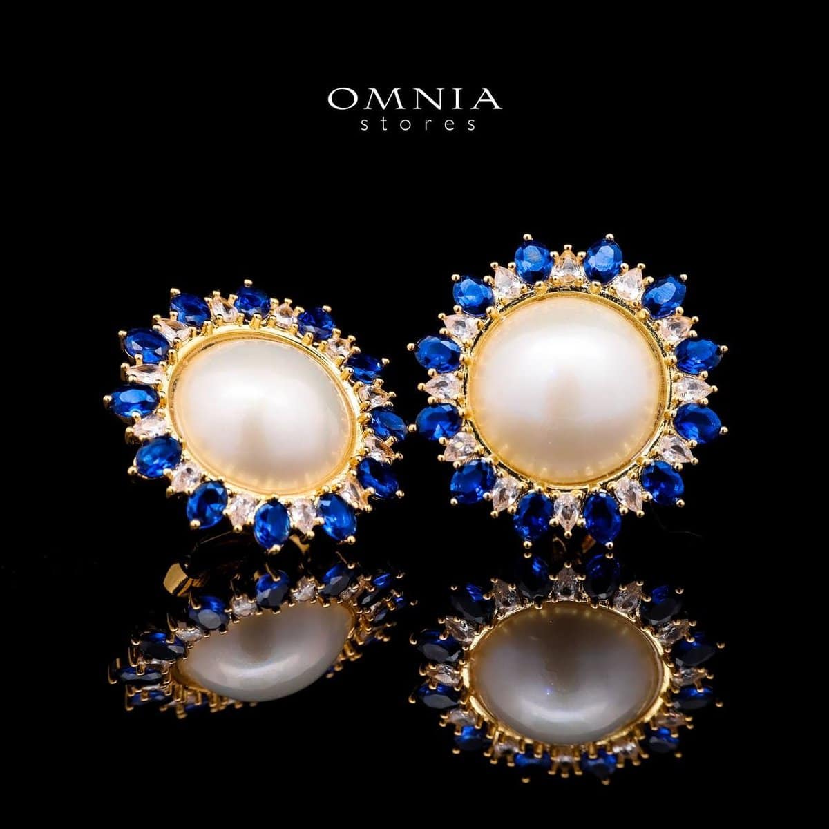 Omnia Celeste White Mabel Pearl Halo Stud Earrings with Blue Sapphire Accents in Brass with Gold Plated Finish image number null